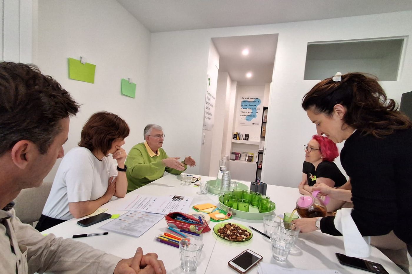 Intergenerational group working around the table in France